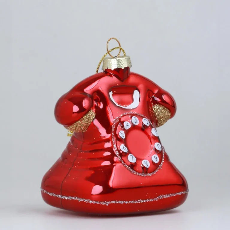 A small red rotary phone tree ornament with glitter.
