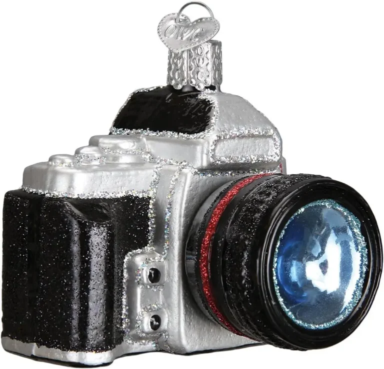 A Christmas tree ornament of a retro camera with glitter and shine.