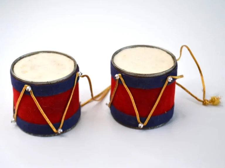 Two small vintage Christmas tree ornaments of tin drums made of felt.