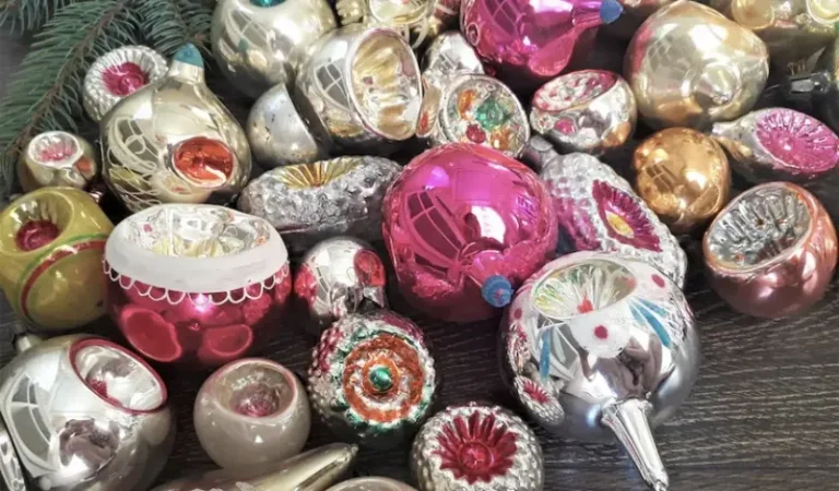 A closeup view of bright, shiny, colorful mid-century indent Christmas tree ornaments.
