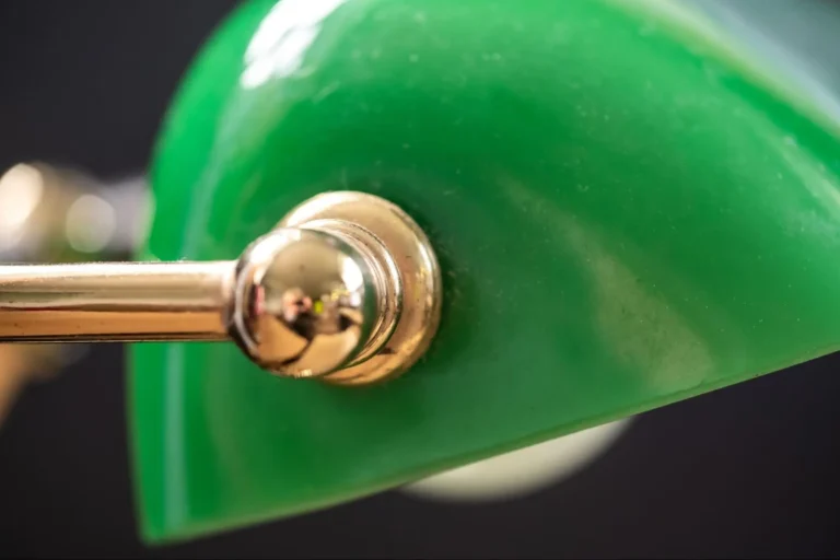 A close-up view of a green banker lamp.