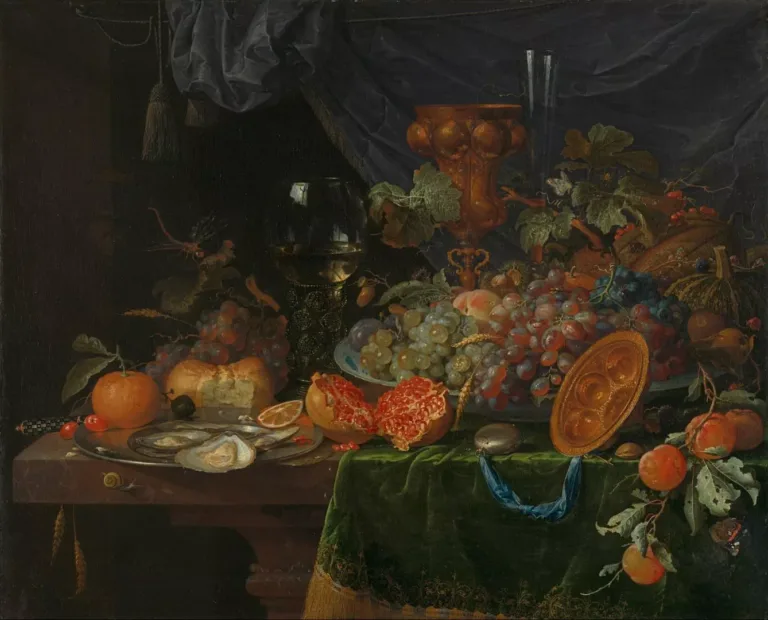 A medieval painting of fruit and a chalice of wine sitting on velvet green cloth.