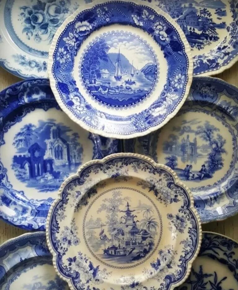 Vintage blue and white china plates elegantly arranged on top of one another.