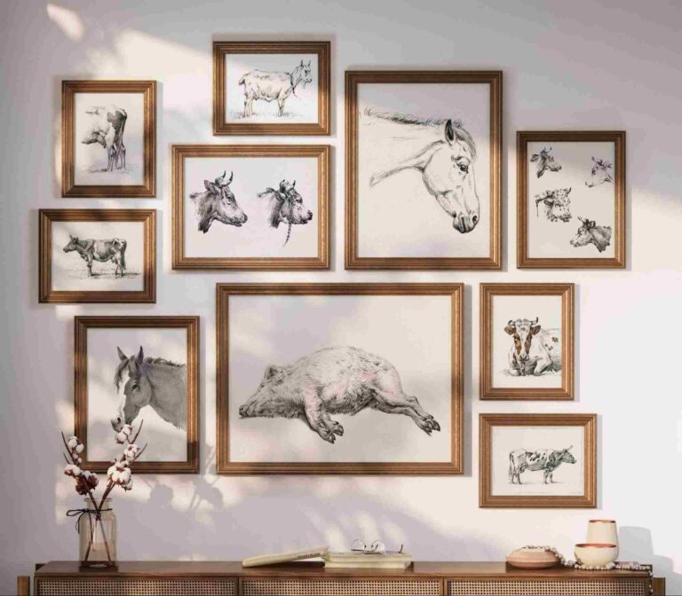 Ten horizontal and vertical vintage frames featuring antique farmhouse drawings of farmhouse animals such as cows, pigs, bulls, horses, and goats arranged into a wall gallery.