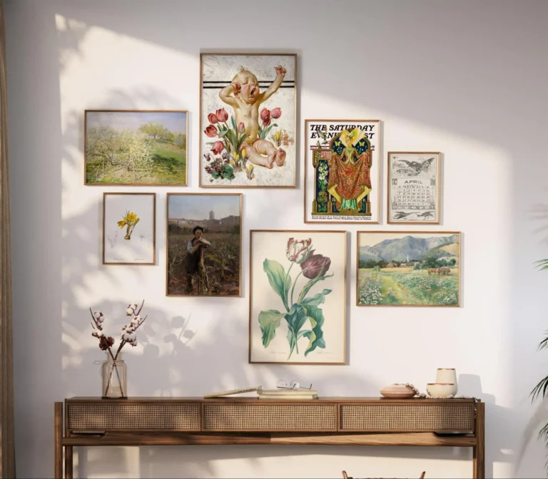 Eight horizontal and vertical frames of varying sizes with vintage Spring decor illustrations hang on a wall.