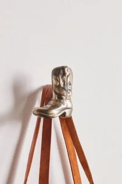 A vintage metal wall hook in the shape of a cowboy boot. Source: Urban Outfitters