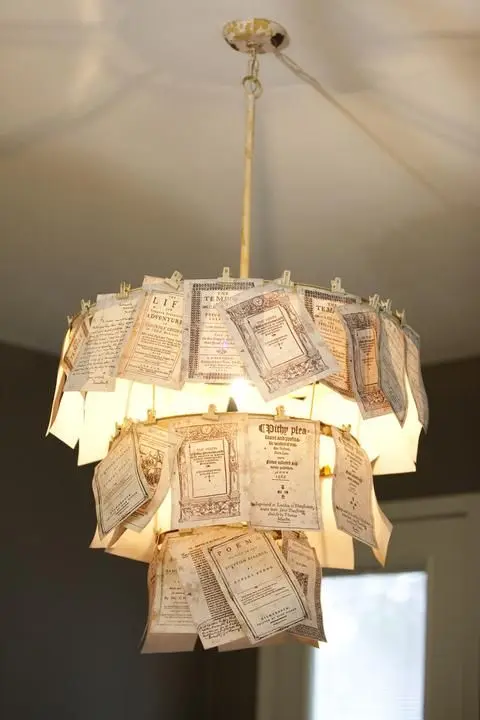 A DIY chandelier made up of antique book pages.