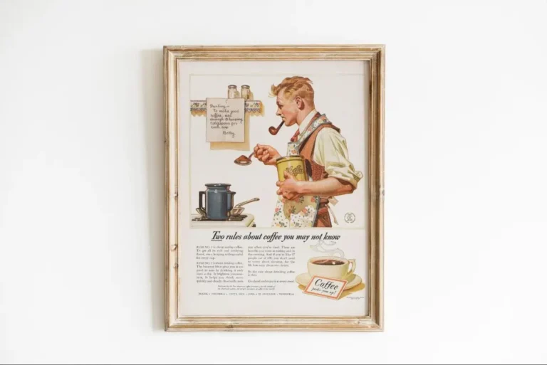 A vintage poster in a rustic frame featuring a 1950s coffee advertisement with a man smoking a pipe and preparing coffee in his kitchen.