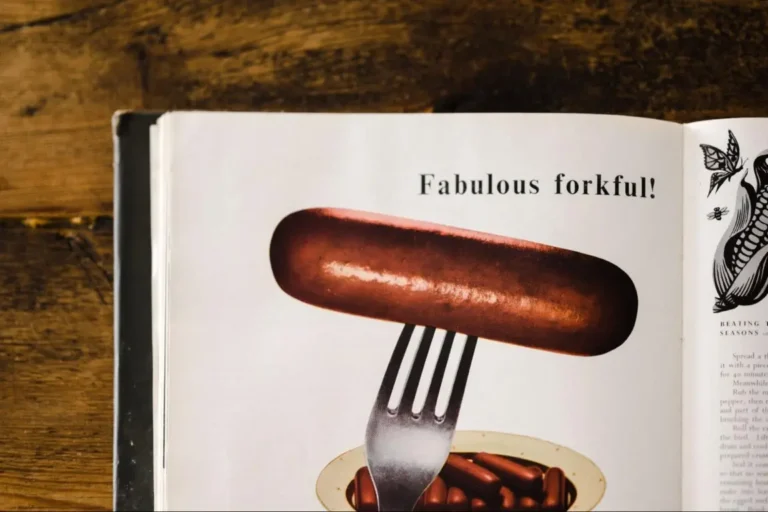 A page from a vintage cookbook depicting sausage on a fork – 1970s vintage wall decor.