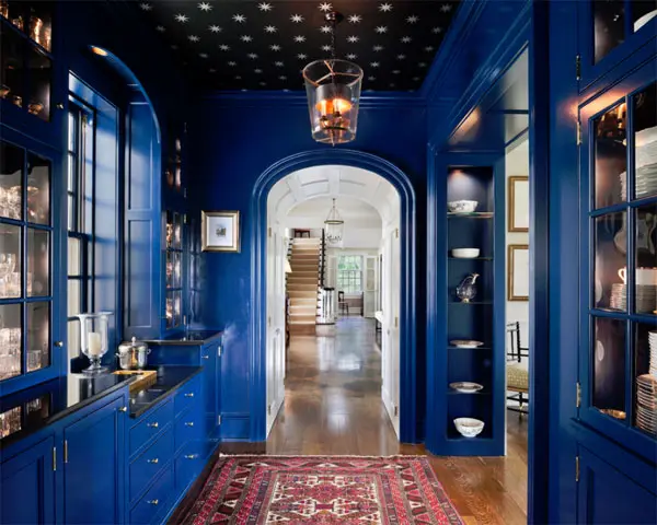 The inside of a blue butler’s pantry designed by Archer & Buchanan.